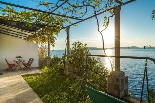 a house with a view of the water at Apartments Dia in Dubrovnik