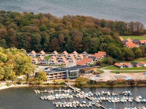 een luchtzicht op een resort met boten in het water bij 6 person holiday home on a holiday park in Gr sten in Gråsten