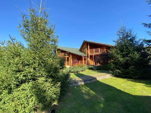 a large house with trees in front of it at Arnika in Skhidnitsa