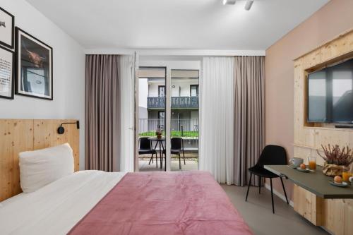 Krevet ili kreveti u jedinici u okviru objekta Arbio I Rooms & Apartments Freiburg