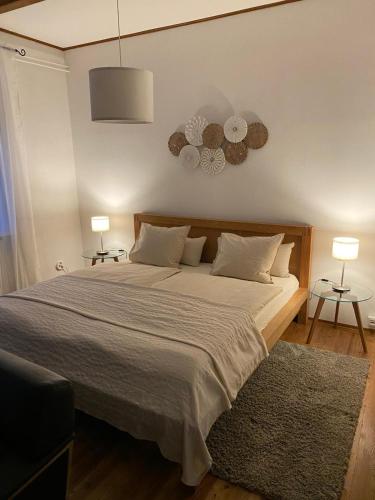 Rúm í herbergi á Apartment mit Sauna im Wienerwald - Mödling