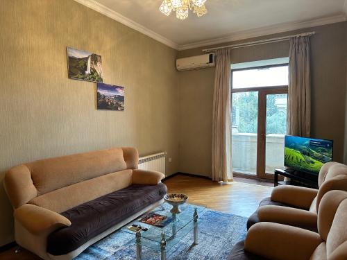 Svetainės erdvė apgyvendinimo įstaigoje Armani apartment