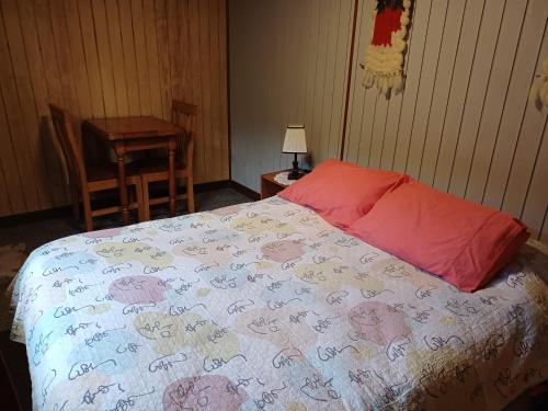 a bedroom with a bed with hearts on it at Hospedaje Picoyo in Pucón