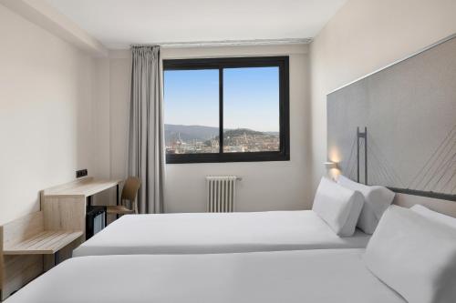 Posteľ alebo postele v izbe v ubytovaní B&B HOTEL Vigo