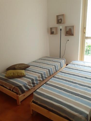 A bed or beds in a room at HOME casa vacanze