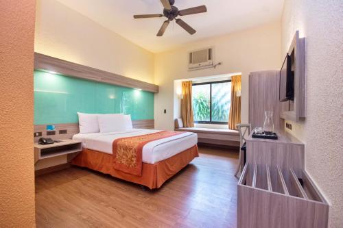 Voodi või voodid majutusasutuse Microtel by Wyndham Boracay toas