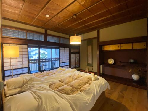 Postelja oz. postelje v sobi nastanitve 城下町の一棟貸し 今来 Konrai - Private-use guesthouse