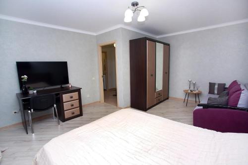 Televisor o centre d'entreteniment de Apartament Vasilya Porika 48 Street Vinnitsya