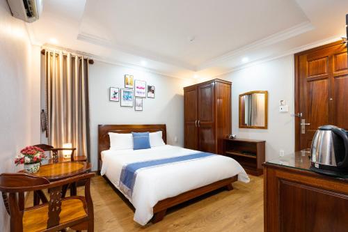 A bed or beds in a room at CAMY Hotel Vung Tau