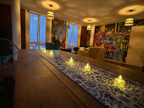 a bar with candles on top of a table at Casa Talavera Hostel in Mexico City