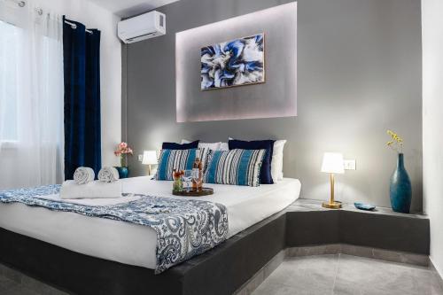 a bedroom with a large bed in a room at MarGio Bay in Limenas