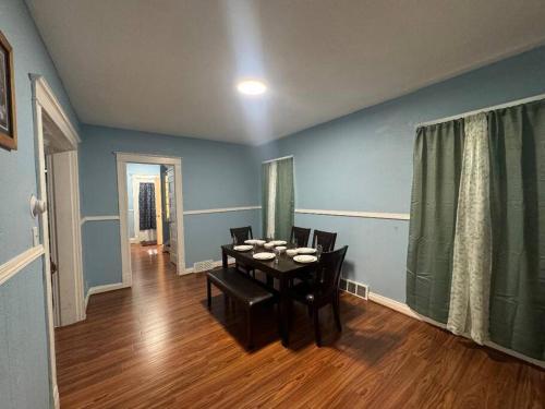 a dining room with a table and chairs at Getaway at Niagara in Niagara Falls