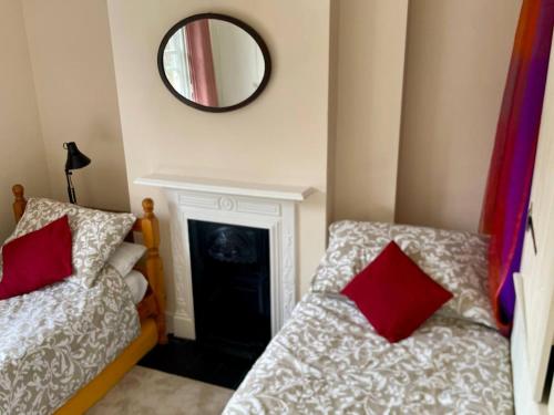 A bed or beds in a room at Damson Cottage