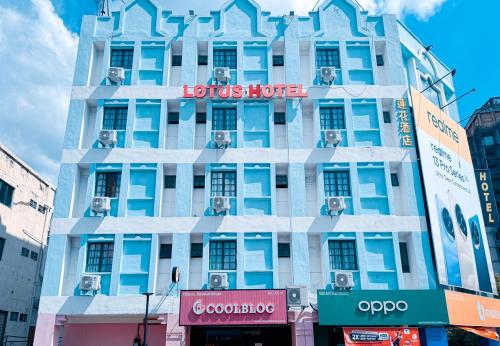 a building with dogs on the windows of it at Sun Inns Seremban Formerly known as Lotus Seremban in Seremban