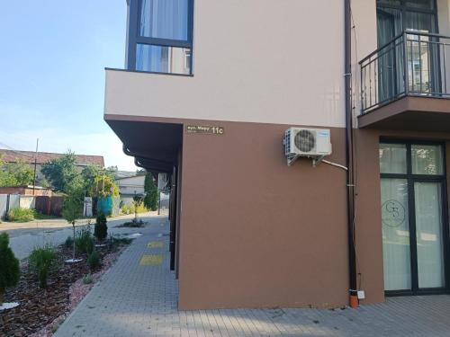 a building with a air conditioner on the side of it at Apartments Domovik Myru St. 11s/21 in Mukacheve