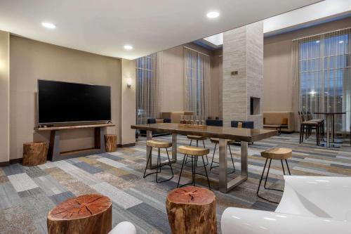 A television and/or entertainment centre at Cambria Hotel West Orange