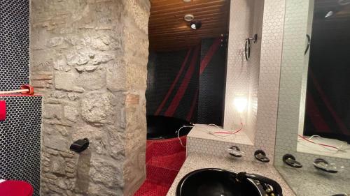 a bathroom with a black sink and a mirror at Lakeside-Apartment-2 Appartement avec une grande terrasse et vue panoramique sur le lac in Vevey