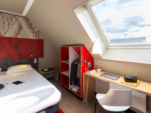 Cama ou camas em um quarto em ibis Epernay Centre Ville