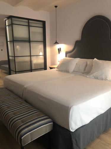 Katil atau katil-katil dalam bilik di Suites Hom Sevilla