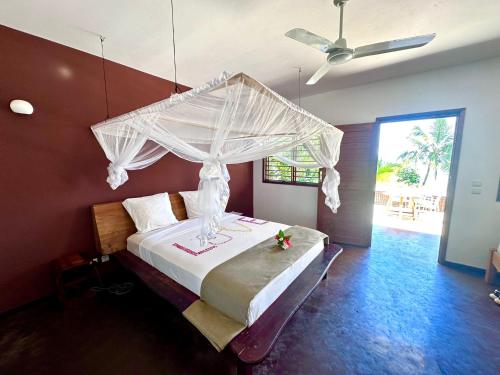 A bed or beds in a room at Anki Lodge