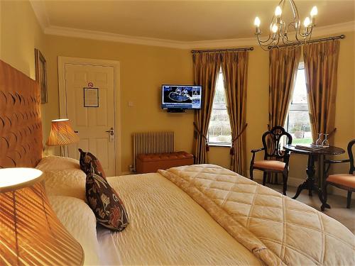 Cama ou camas em um quarto em Brook Manor Lodge