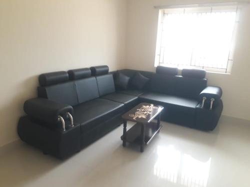 A seating area at Kanmani Elite- A Perfect Home