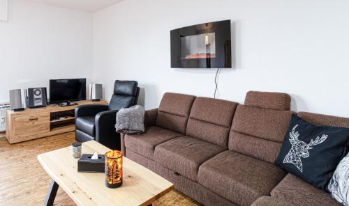 TV in/ali zabaviščno središče v nastanitvi Ferienwohnung Bergzauber Sauna, Bikerpark Ski