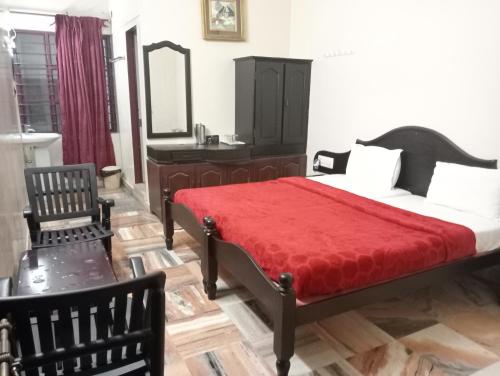 A bed or beds in a room at Hotel Hill Town Coorg