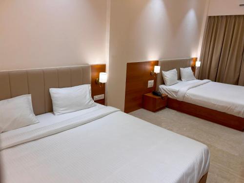 Cama ou camas em um quarto em Hotel Neem Heritage