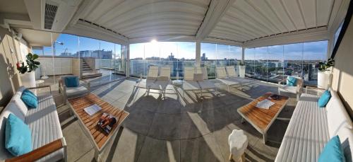 a view of a living room with a view of a city at Almalux Jesolo Wellness & Spa 3 stelle superior in Lido di Jesolo