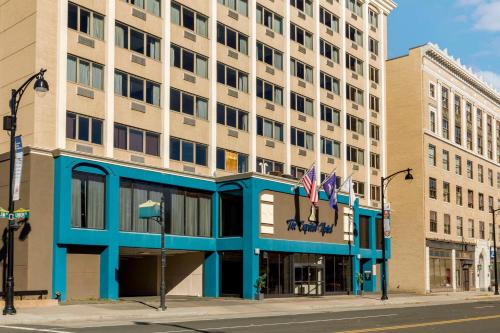 a building with two american flags in front of it at The Capitol Hotel, Ascend Hotel Collection in Hartford