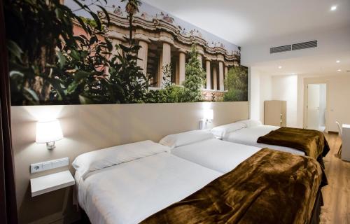 A bed or beds in a room at Hotel BESTPRICE Gracia