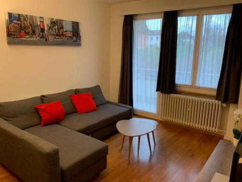 a living room with a couch and a table at Ferienwohnung in Bern in Bern