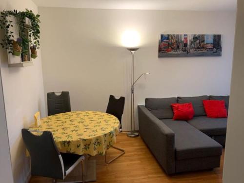 a living room with a couch and a table at Ferienwohnung in Bern in Bern