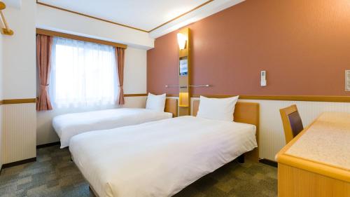 Krevet ili kreveti u jedinici u okviru objekta Toyoko Inn Hirosaki Ekimae