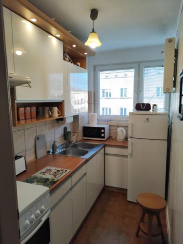 Una cocina o zona de cocina en Apartament Praski 5 minut od metra i starego miasta spacerem do zoo i Konesera