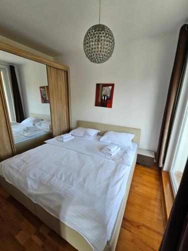 A bed or beds in a room at FOKA APARTMANI 30 m from Junior