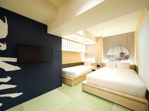 Krevet ili kreveti u jedinici u objektu Travelodge Kyoto Shijo Kawaramachi