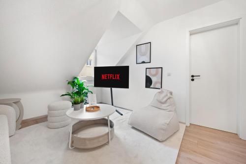 Un lugar para sentarse en Malu Rooms - im Stadtzentrum, SmartTV, Netflix, 24h Checkin