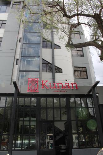 a kimann building with a sign on it at Kunan Hotel in Cochabamba