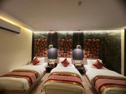 A bed or beds in a room at P Quattro Relax Hotel