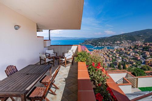 a balcony with a table and chairs and a view at Residence Sole Dell'Argentario in Porto Santo Stefano