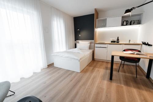 Ett kök eller pentry på The Place Herzogenaurach - Serviced Apartments