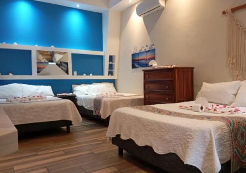 Giường trong phòng chung tại Hotel Boutique Casa Mariano