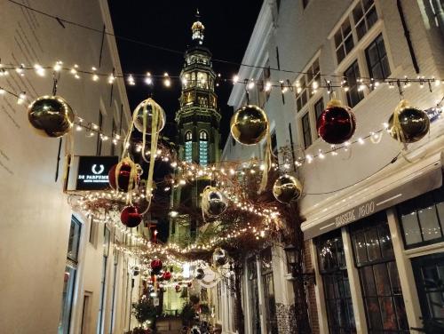 a street with christmas lights and a clock tower at CITY HOUSE Adults Only in Middelburg