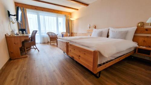 מיטה או מיטות בחדר ב-Sunstar Hotel Lenzerheide