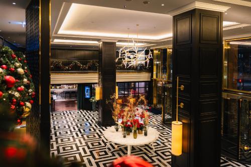 a christmas tree in the lobby of a hotel at Hilton Vienna Plaza in Vienna