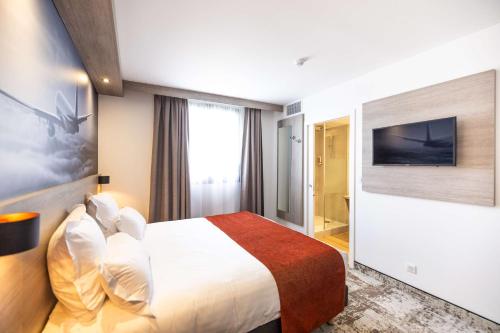 Postelja oz. postelje v sobi nastanitve Best Western Saint Exupéry Eysines - Bordeaux Ouest