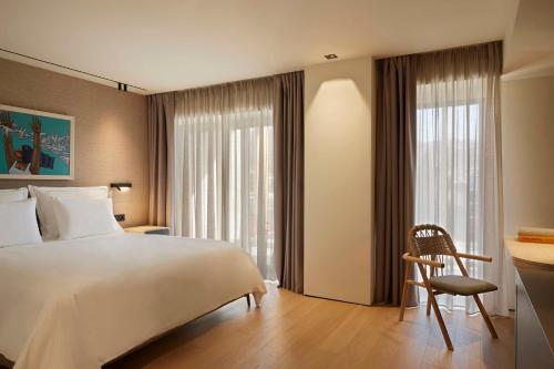 Tempat tidur dalam kamar di Dusit Suites Athens