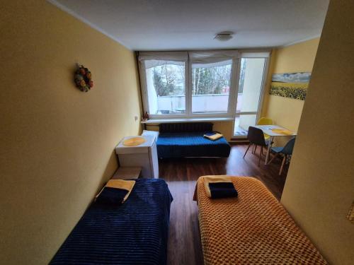 A bed or beds in a room at Travel House Wroclaw